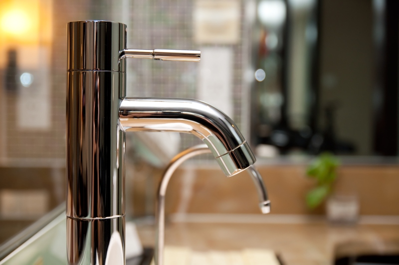 Leaking tap being repaired in Coulsdon